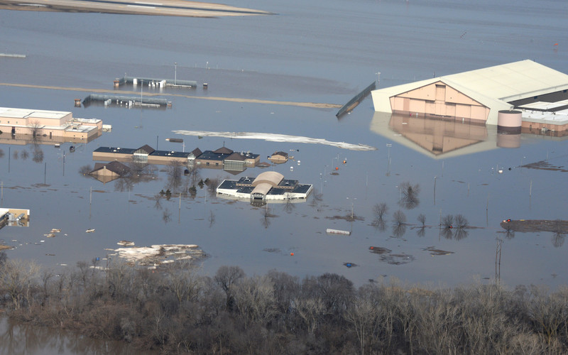 Aerial photography of Offutt Air Force Base, Nebraska, taken March 17. One-third of the base was underwater after the Missouri River flooded. The U.S. Army Engineering and Support Center, Huntsville, Fuels Program contract maintains and repairs bulk fuel storage facilities and equipment and is being used in flood recovery efforts at the base.