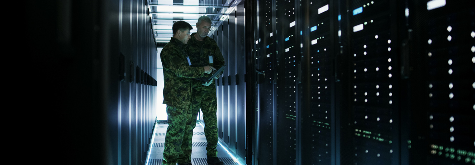 Army officers in a data center 