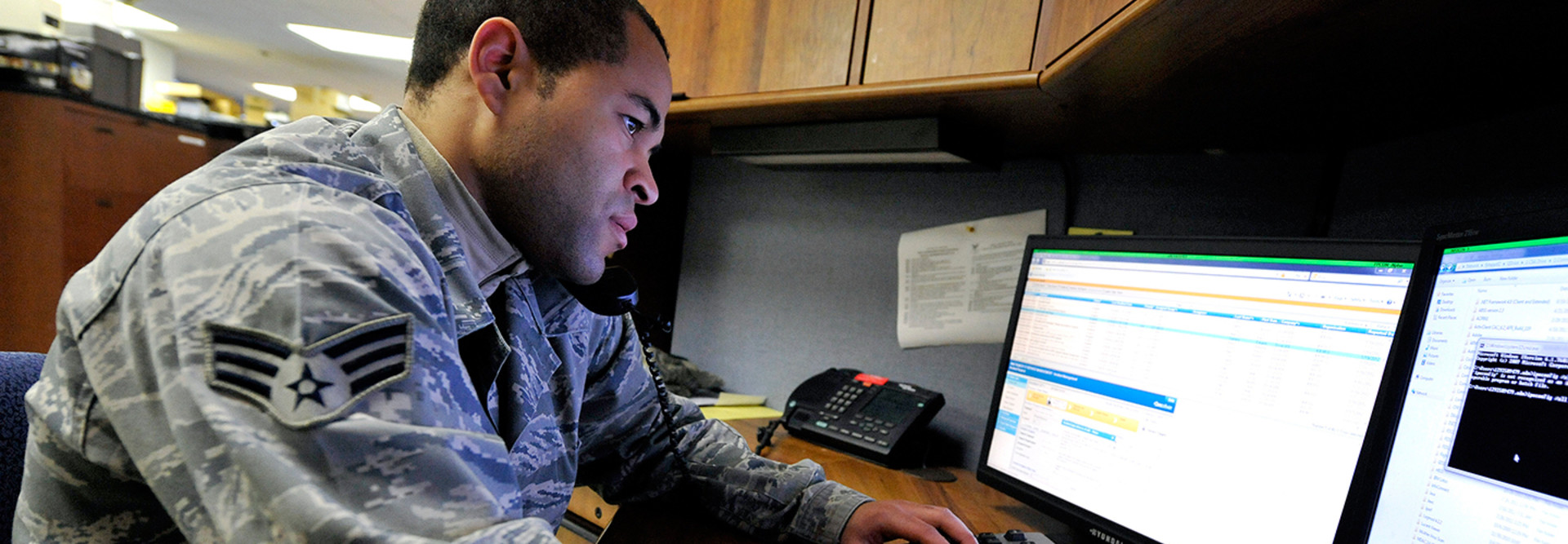 Senior Airman Jason McKenzie, client systems technician from the 436th Communications Squadron, troubleshoots a computer issue by remotely logging into a customer's computer Jan. 19, 2012, at Dover Air Force Base, Del. 