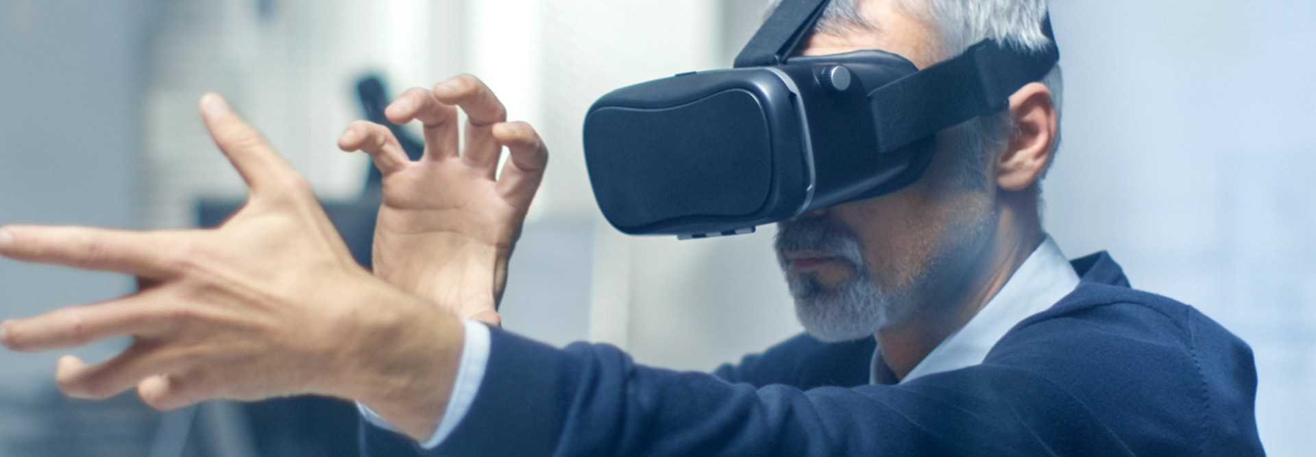 Federal worker manipulating a virtual object while wearing a VR headset 