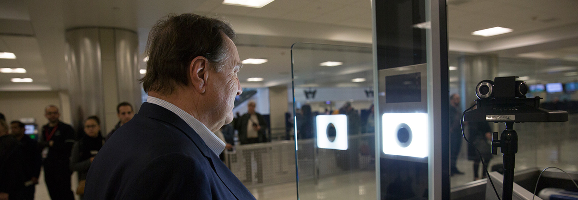 U.S. Customs and Border Protection officers screen international passengers arriving at the Dulles International Airport in Dulles, Va., November 29, 2016