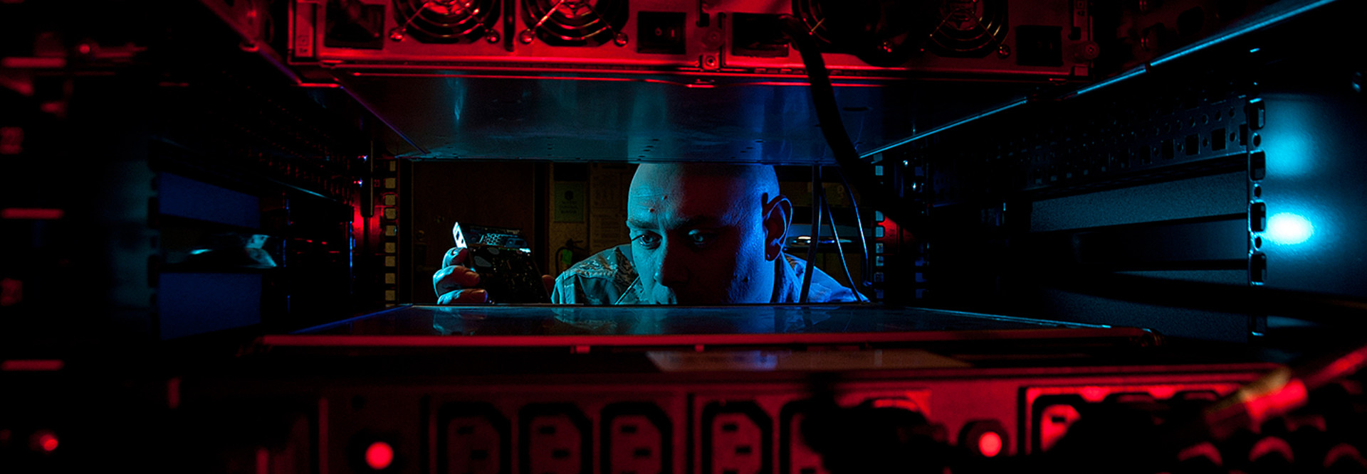 Air Force Staff Sgt. Jerome Duhan, a network administrator with the 97th Communications Squadron, inserts a hard drive into the network control center retina server at Altus Air Force Base, Okla., Jan. 24, 2014, in preparation for a command cyber readines inspection.
