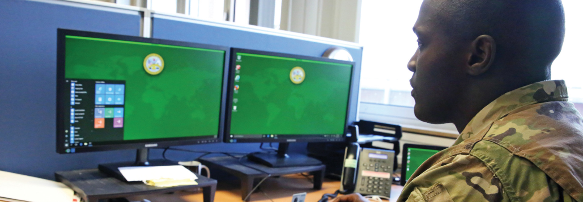 .S. Army Staff Sgt. Johnnie Robinson, 2nd Theater Signal Brigade command group noncommissioned officer, uses a government computer with Microsoft Windows 10 operating system, Oct. 2, 2017 in Wiesbaden, Germany.