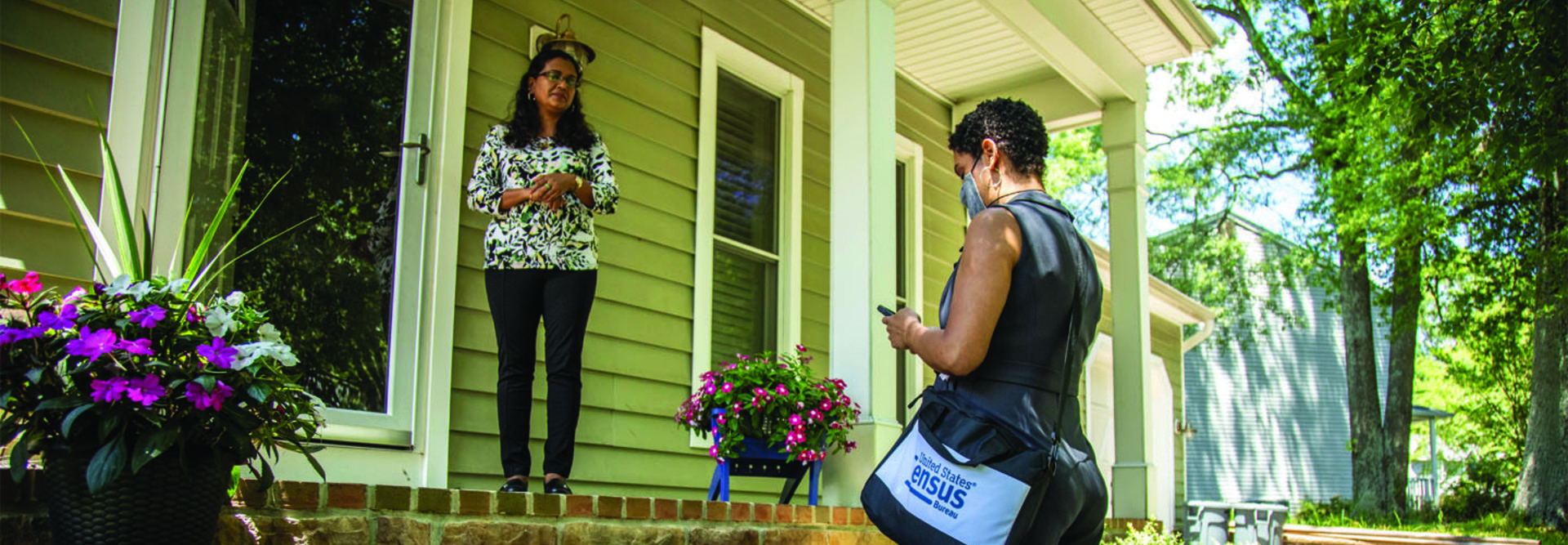 Census taker uses smartphone to interview citizen