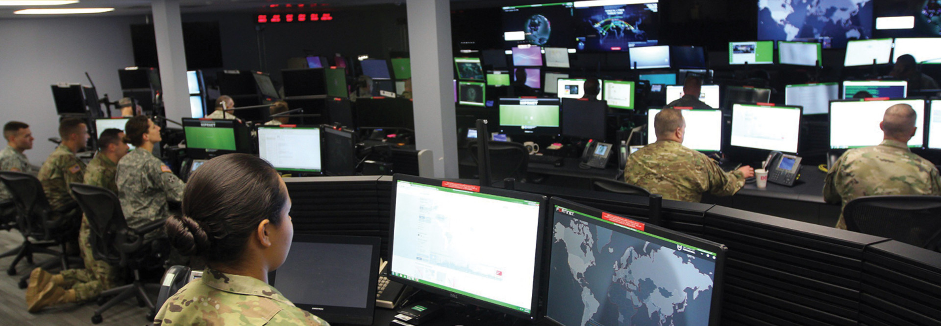 Sgt. Marisa Tortolano, a cyber operations specialist assigned to the 780th Military Intelligence Brigade, stands in the watch officer position of the Joint Mission Operations Center.