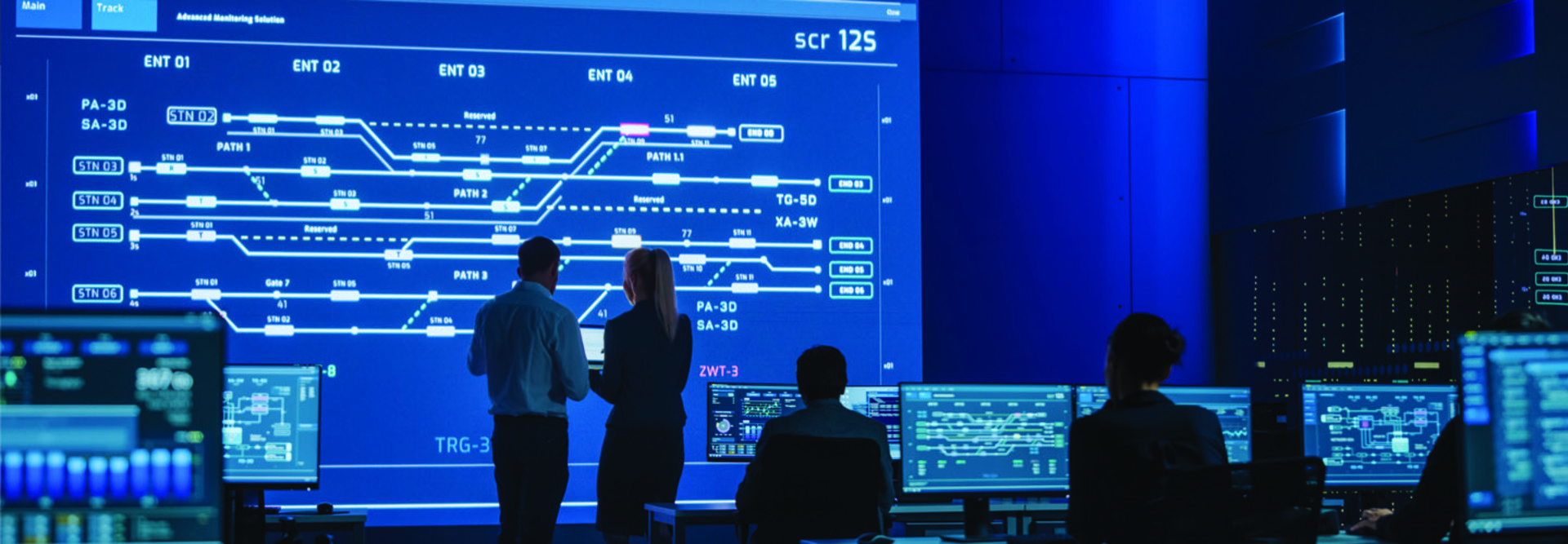 Man and woman in front of screen
