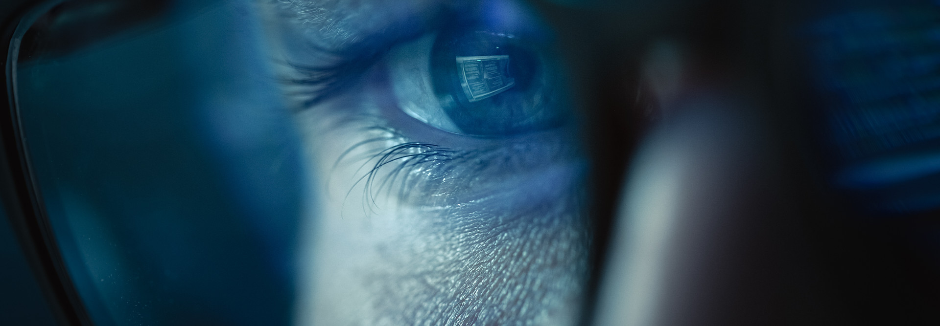 Close up of an engineer overseeing code