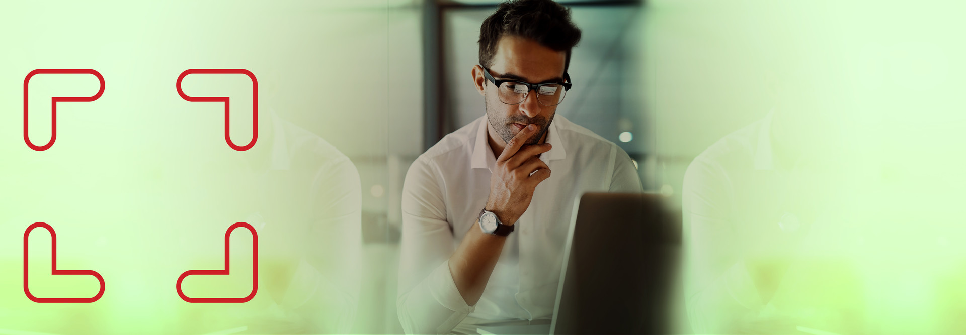 man considering computer with square logo to the left