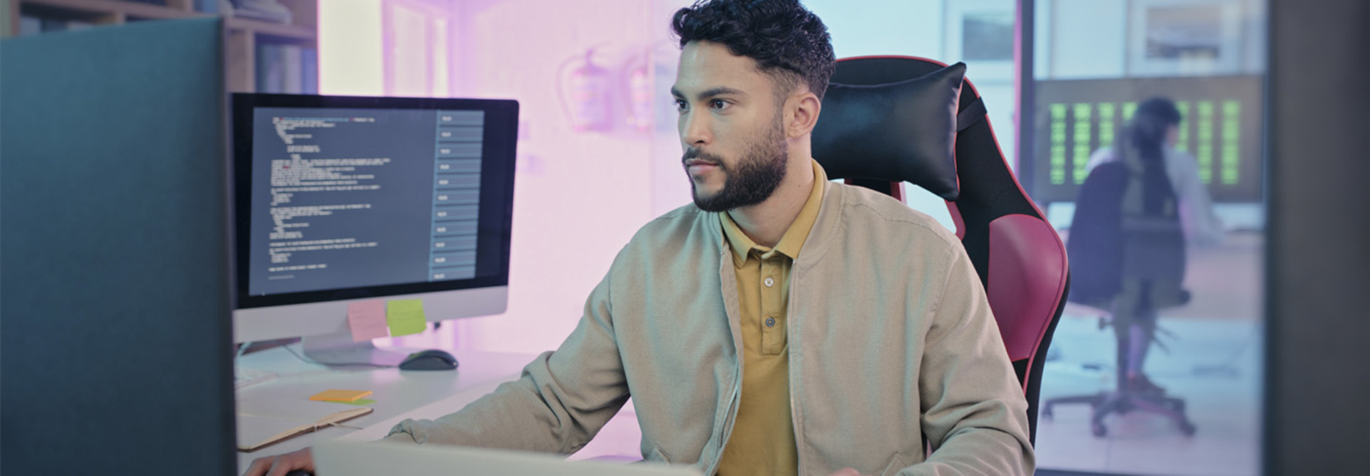 Person coding at computer