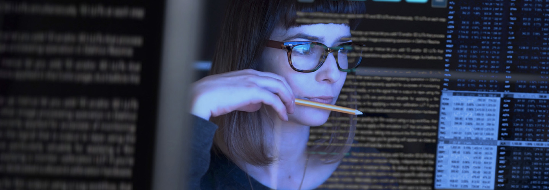 Person reviewing data at computer