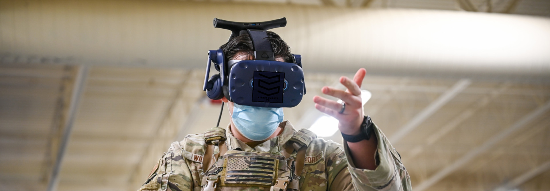 An Air Force serviceman uses an AR/VR headset