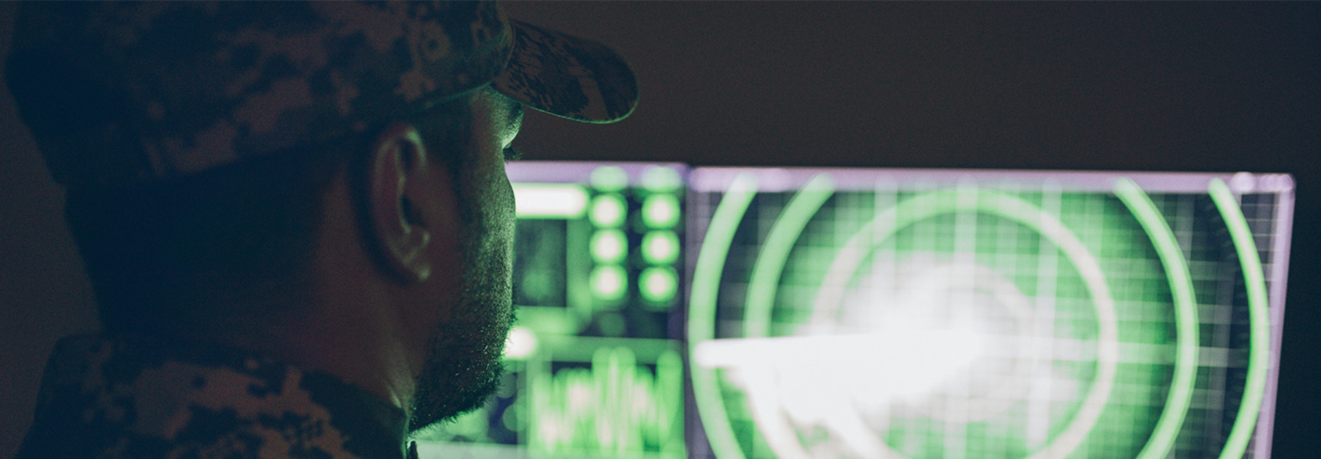 An Army soldier at a computer screen