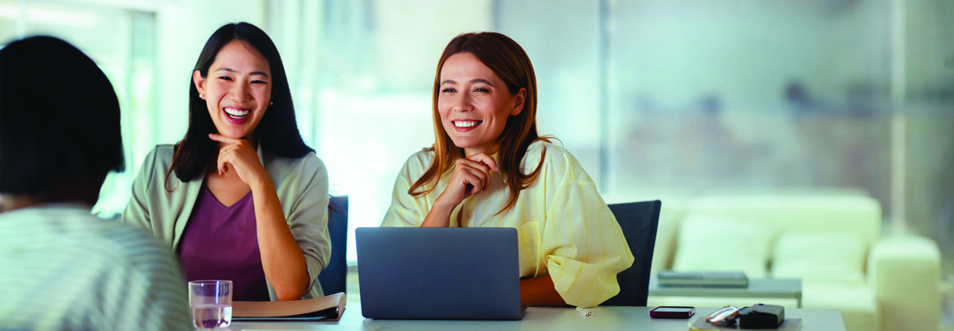 Three people in a business meeting