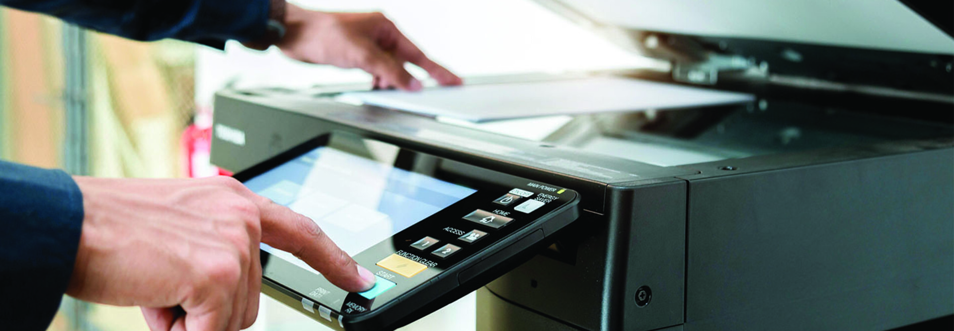 Person using a printer in the office