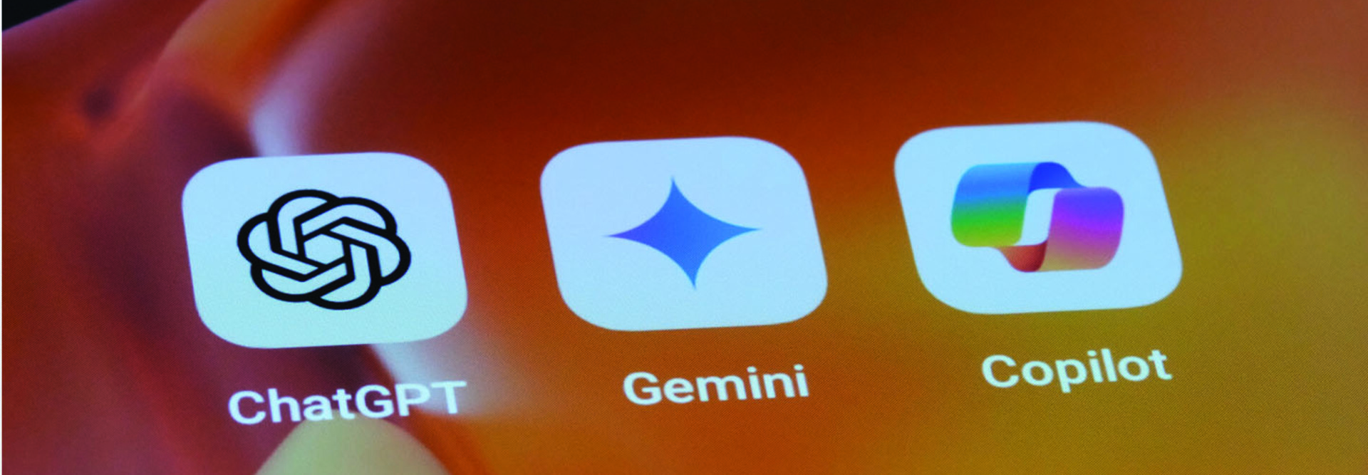 Popular AI chatbot logos on a mobile device