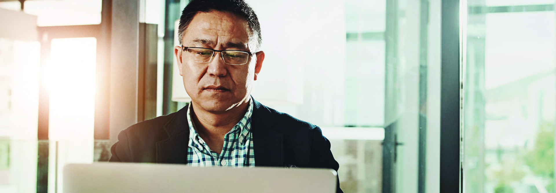 Man submitting information on a laptop