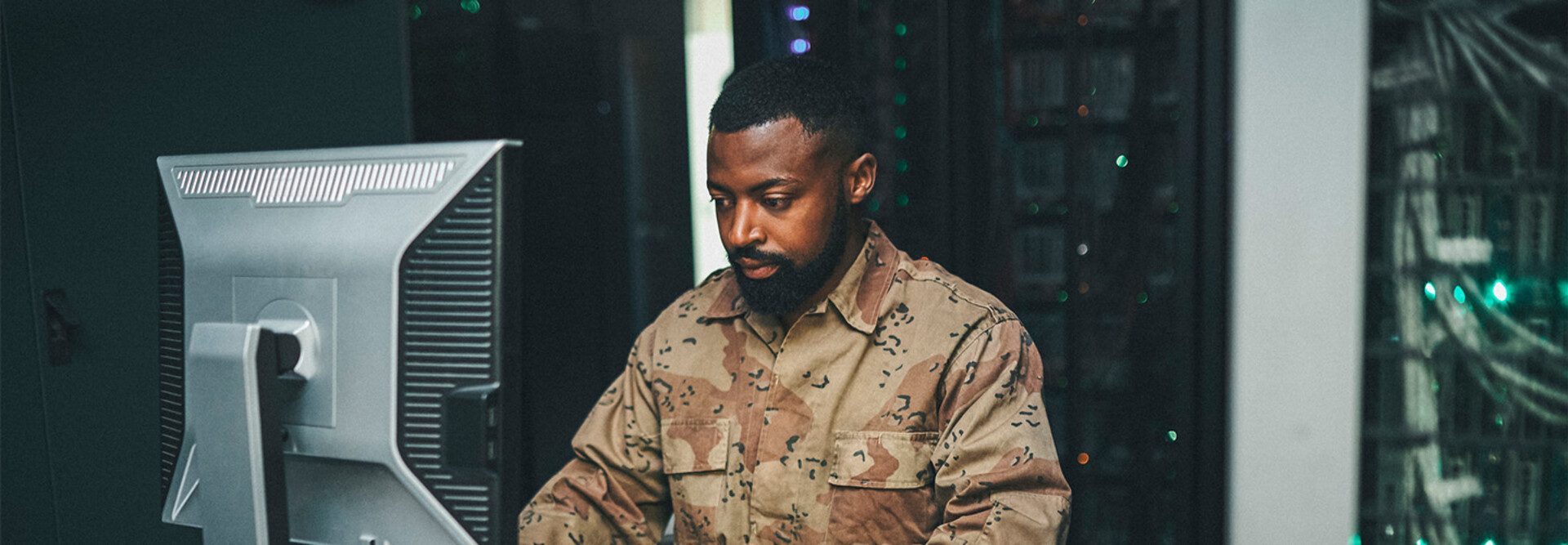 Soldier working on computer