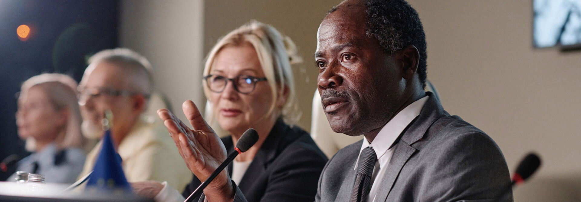 People speaking into microphones