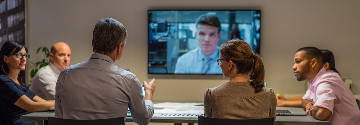 Federal workers in a videoconference meeting with a coworker 