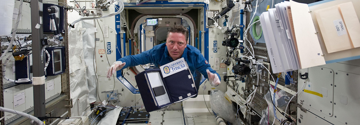 ESA astronaut Roberto Vittori posing for a photo with the eValuatIon And monitoring of microBiaL biofilms insidE ISS (VIABLE ISS) experiment.