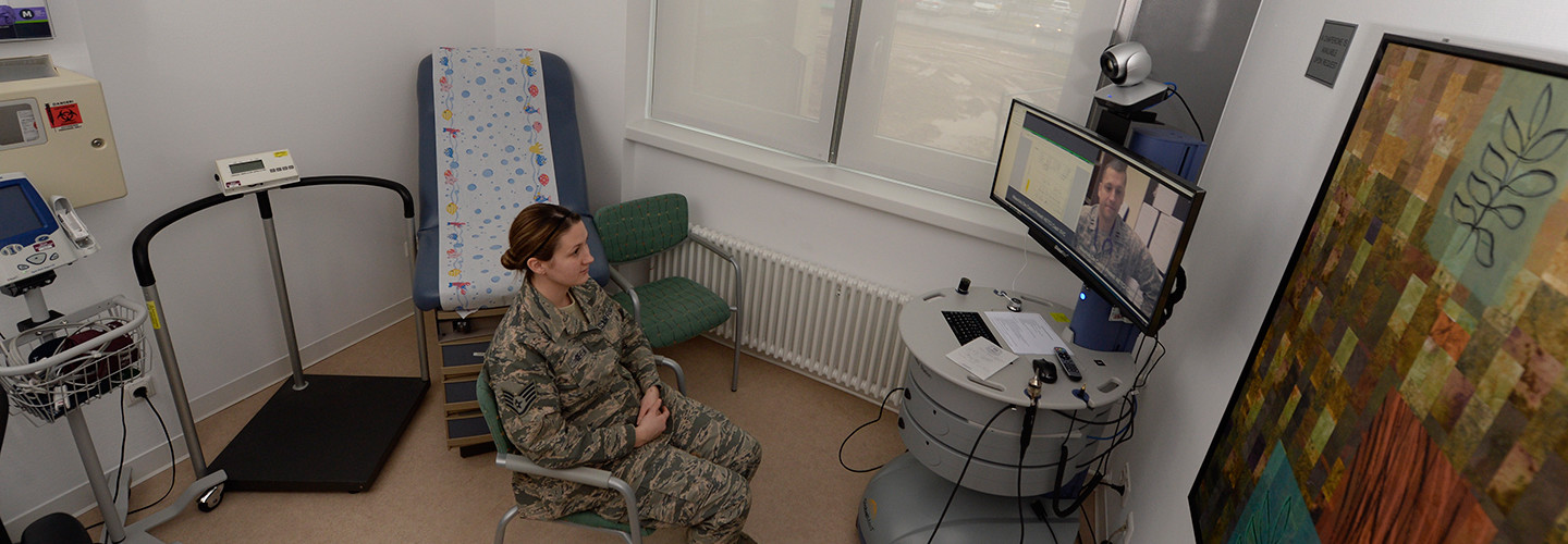 Senior Airman Kimberly Deveau sits in a private room at Spangdahlem Air Base, Germany as she receives specialty genetic counseling via a video teleconference from Capt. (Dr.) Mauricio De Castro, staff medical geneticist at Keesler Air Force Base, Miss., Feb. 1, 2018