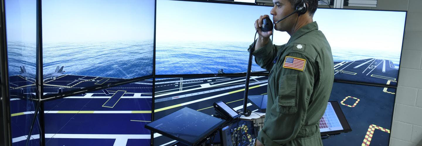 Commander Jason Cassisi, air boss aboard the aircraft carrier USS George H.W. Bush participates in a final prototype demonstration of the Office of Naval Research TechSolutions-sponsored Flight Deck Crew Refresher Training Expansion Packs.