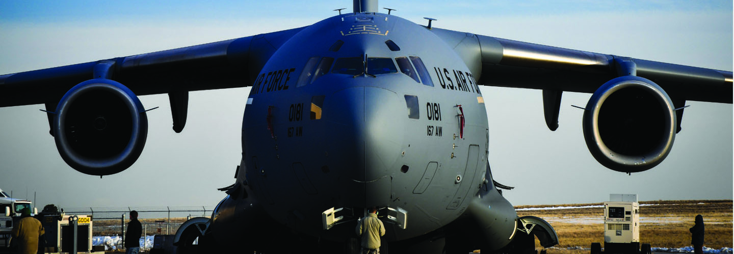 C-17 Globemaster III sits on a flightline; nose points towards camera