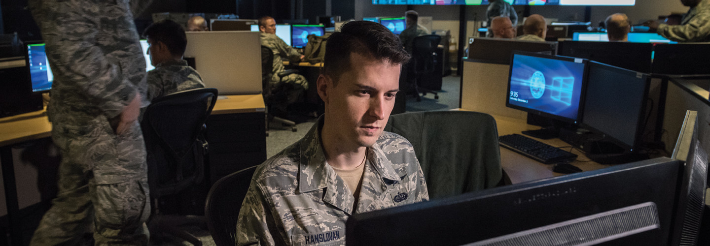 Tech. Sgt. Kyle Hanslovan, a cyber-warfare specialist serving with the 175th Cyberspace Operations Group of the Maryland Air National Guard, works in the Hunter's Den at Warfield Air National Guard Base, Middle River, Md., Dec. 2, 2017. 