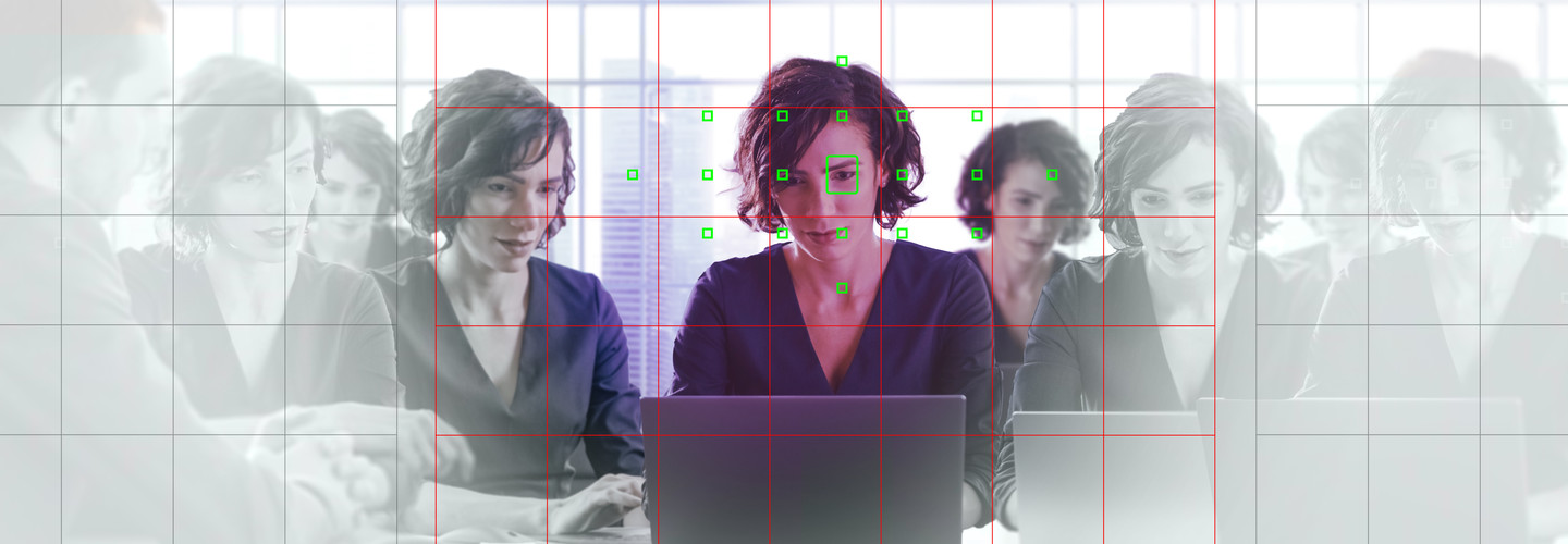 Reflected image of person using computer