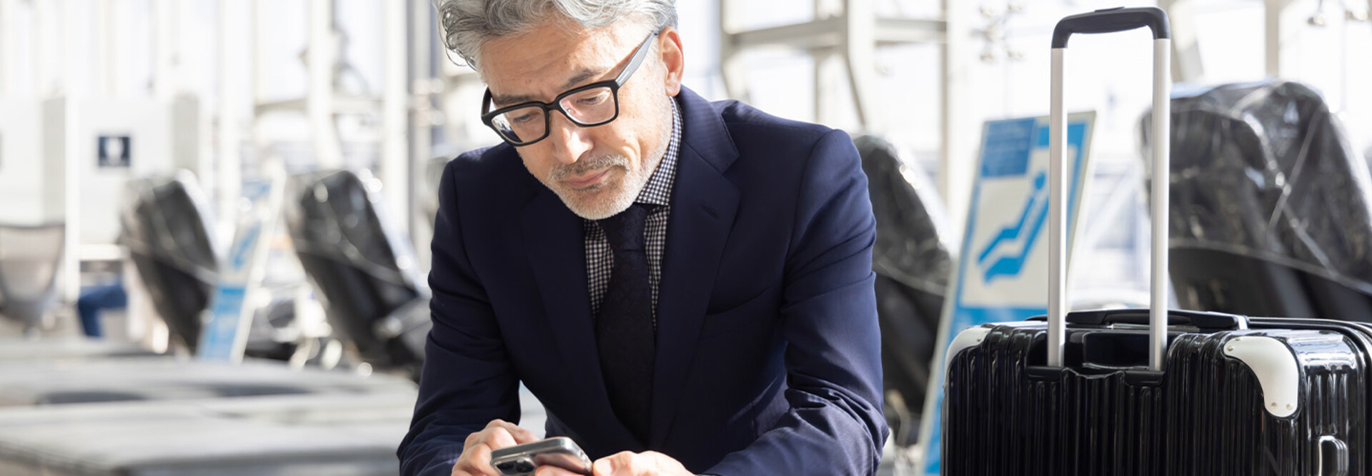 Person using mobile device in airport