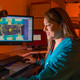 Sandia National Laboratories researcher Rachelle Thompson inspects an electronic device that’s part of a 30-year Sandia program to look at how environments, including radiation from a nuclear weapon itself, could affect the performance of electronics inside a W76-1 warhead. The study, begun in 2006, will provide real-time data for the first time on how electronics age within a weapon.
