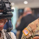 Army intern tries on a virtual reality headset