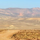 Desert road with mountains