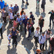 People walking through city