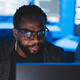 Two men looking at computer screen