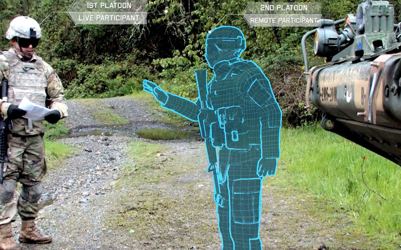 A Stryker vehicle commander interacts in real time with a remotely operated avatar. The United States Army Research Laboratory is working with other organizations to create a synthetic training environment that includes augmented reality.