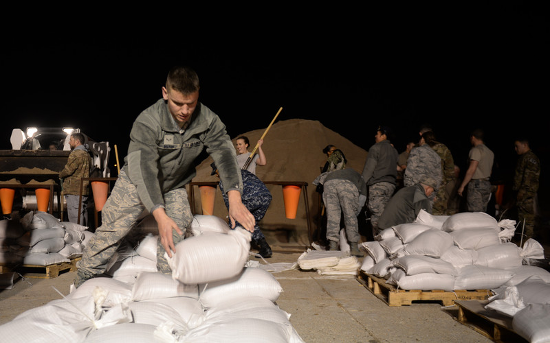 Airmen stacked sandbags at Offutt Air Force Base as flood waters rose in March. Despite their efforts, the base suffered $420 million in damage.