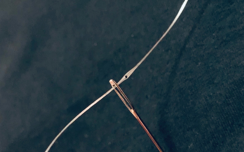 The programmable fiber is thin and flexible and can pass through a needle, be sewn into fabrics, and washed at least 10 times without breaking down.