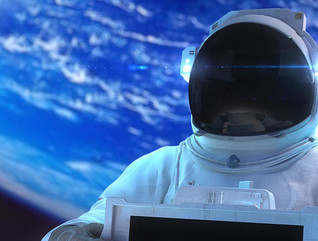 Astronaut holds in hands the electronic display.