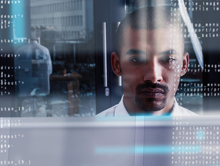 Man working on cybersecurity at his computer 