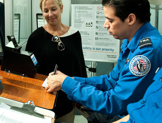 TSA officials checking passenger information