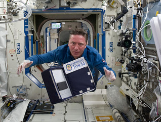 ESA astronaut Roberto Vittori posing for a photo with the eValuatIon And monitoring of microBiaL biofilms insidE ISS (VIABLE ISS) experiment.