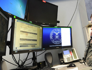 Senior Airman Dakota Powers, Air Force Rescue Coordination Controller, monitors computer screens while taking a phone call April 5 at the 601st Air Operations Center. The facility is staffed 24/7 to respond to, and coordinate rescue operations.