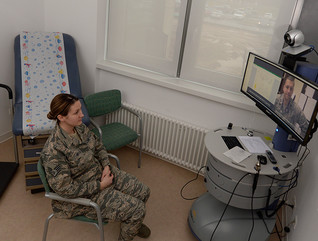 Senior Airman Kimberly Deveau sits in a private room at Spangdahlem Air Base, Germany as she receives specialty genetic counseling via a video teleconference from Capt. (Dr.) Mauricio De Castro, staff medical geneticist at Keesler Air Force Base, Miss., Feb. 1, 2018