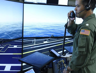 Commander Jason Cassisi, air boss aboard the aircraft carrier USS George H.W. Bush participates in a final prototype demonstration of the Office of Naval Research TechSolutions-sponsored Flight Deck Crew Refresher Training Expansion Packs.