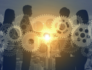 People surrounded by gears