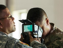 U.S. Army Reservists learn how to use iris scans to identify personnel during a training exercise.