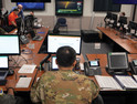 The 55th Wing’s Recovery Operations Center staff works 16-hour shifts disseminating information to the base populace regarding the flooding caused by the Missouri River on March 19, 2019. The river breached the levee system, which widened the river’s footprint, covering half the base. 