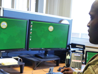 .S. Army Staff Sgt. Johnnie Robinson, 2nd Theater Signal Brigade command group noncommissioned officer, uses a government computer with Microsoft Windows 10 operating system, Oct. 2, 2017 in Wiesbaden, Germany.