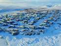 Aerial view of tiny Alaska village in the snow